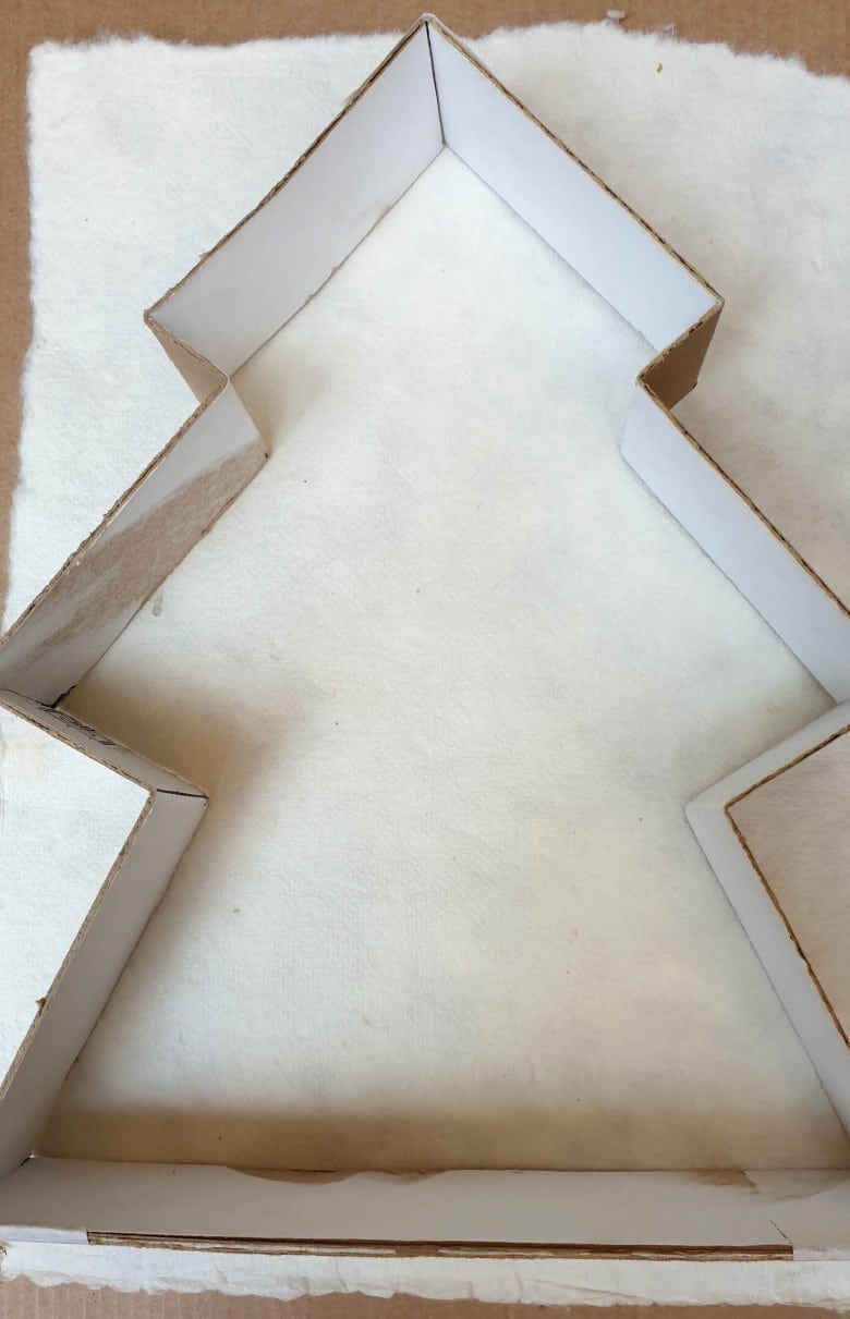 After bending a shaping, the cardboard tree frame will be a little wonky