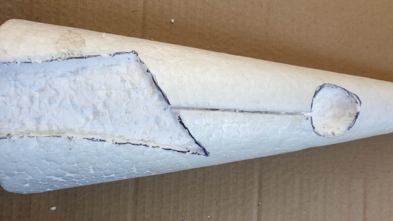 Cut a groove or slit that joins the door to the window