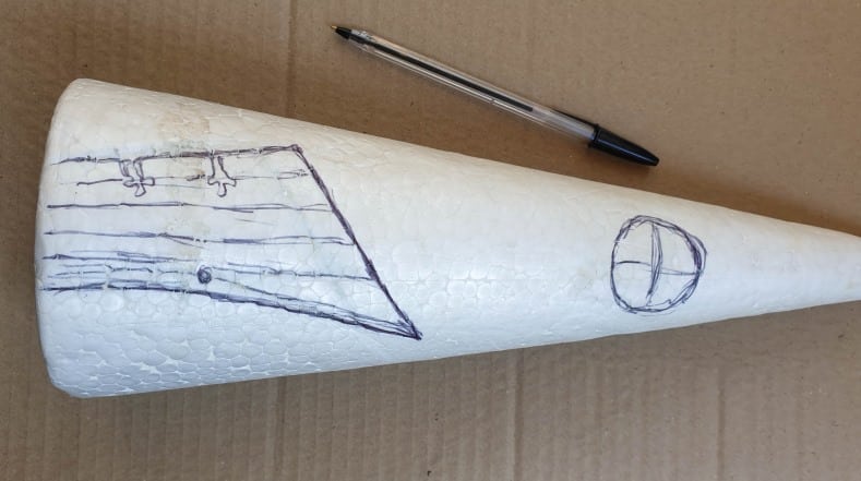 Draw a door and window on the cone before hollowing them out