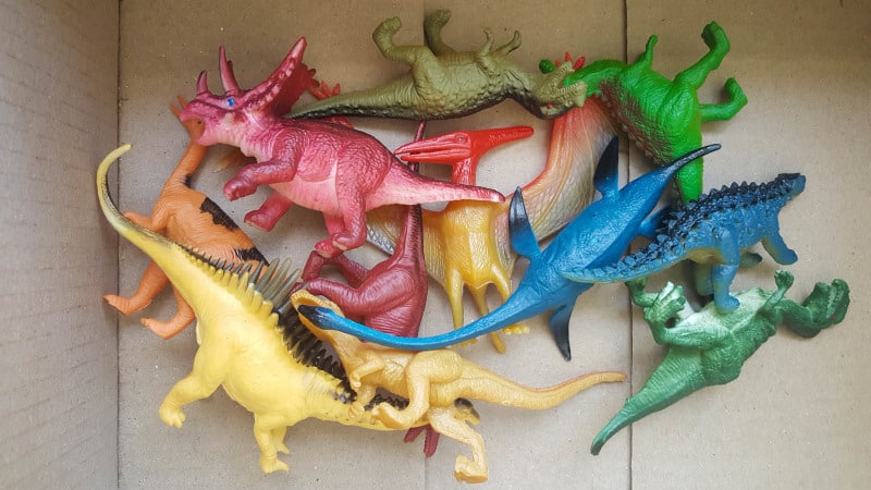 A box of old plastic dinosaurs