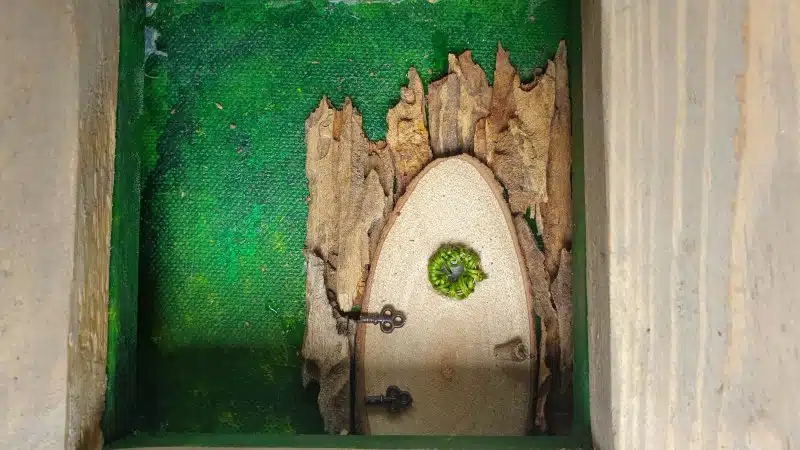 The fairy door is the focal point so glue it on first