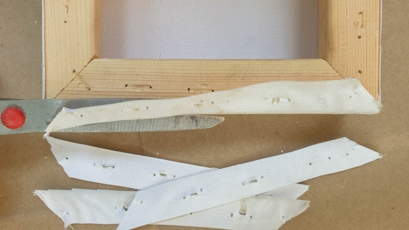 Cut away the excess canvas