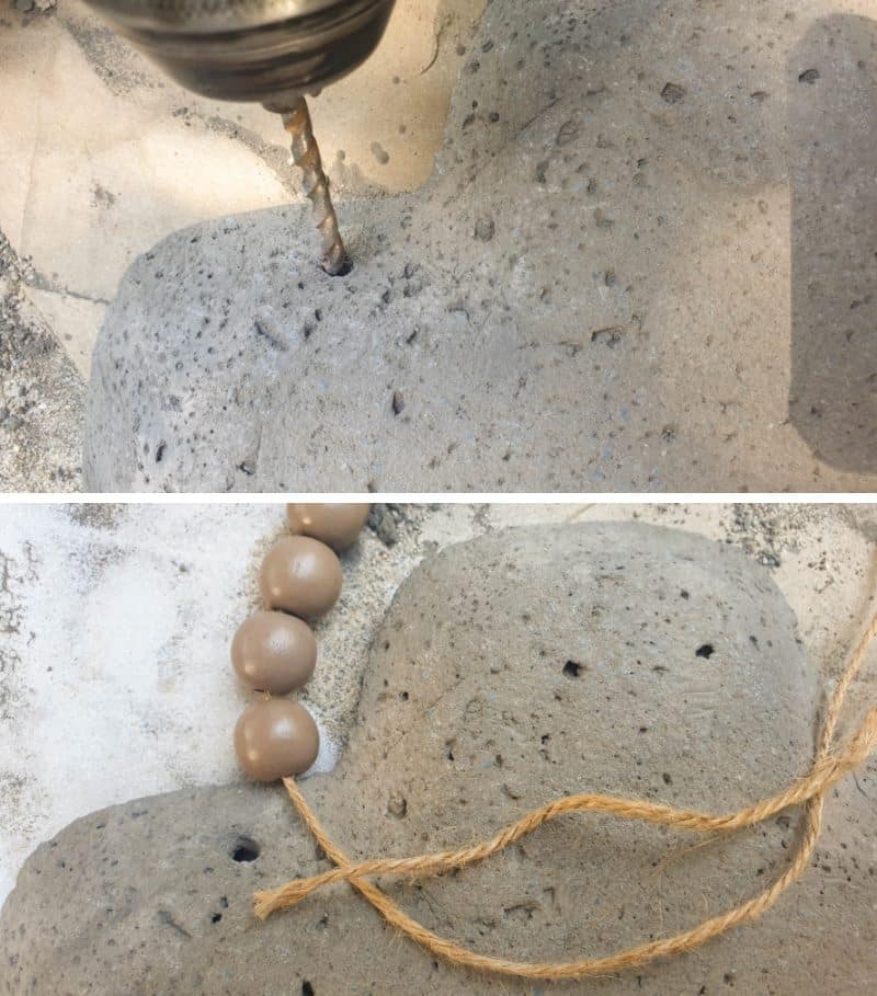 Drill two holes towards the top of the cross and hang with a beads and twine