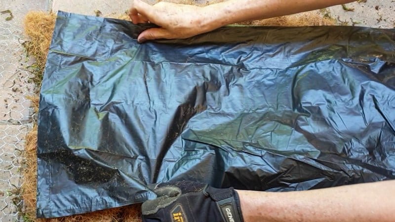 Place a layer of plastic over the moss and coconut fibre