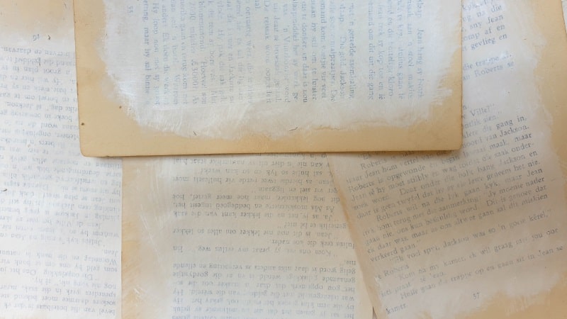 Paint the book pages with a watered down white craft paint