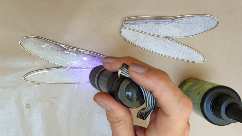 Cure the resin under the UV light