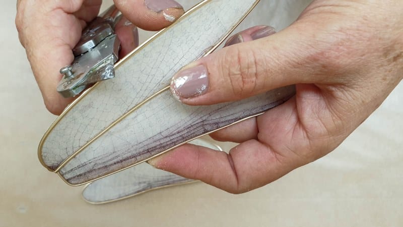 Use a sharp craft knife to trim away any excess paper or resin