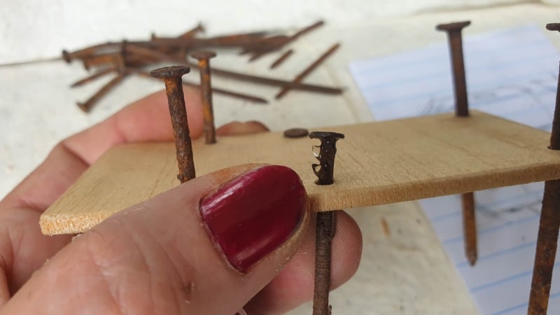 Glue the rusty nail in place