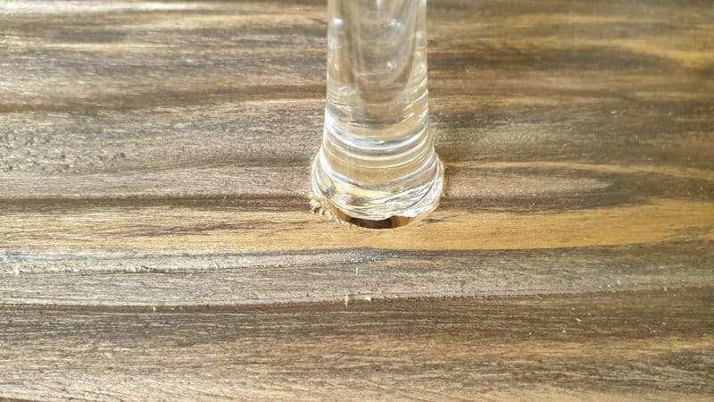 The hole should be just big enough to fit the wineglass stem