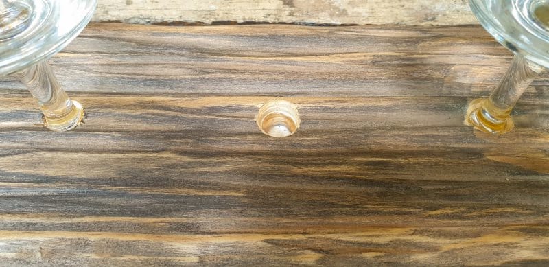 Add a dollop of glue inside the hole and leave to set