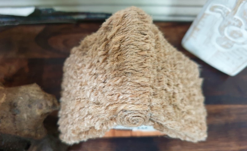 This paper house with a miniature thatch roof is made entirely from scraps and recycled materials, giving it a creative, whimsical feel. The lights add a little magic, and we all need more of that in our lives. In this step-by-step tutorial, we&rsquo;ll show you how you can make your own and share an easy way to thatch a small roof. #ACraftyMix