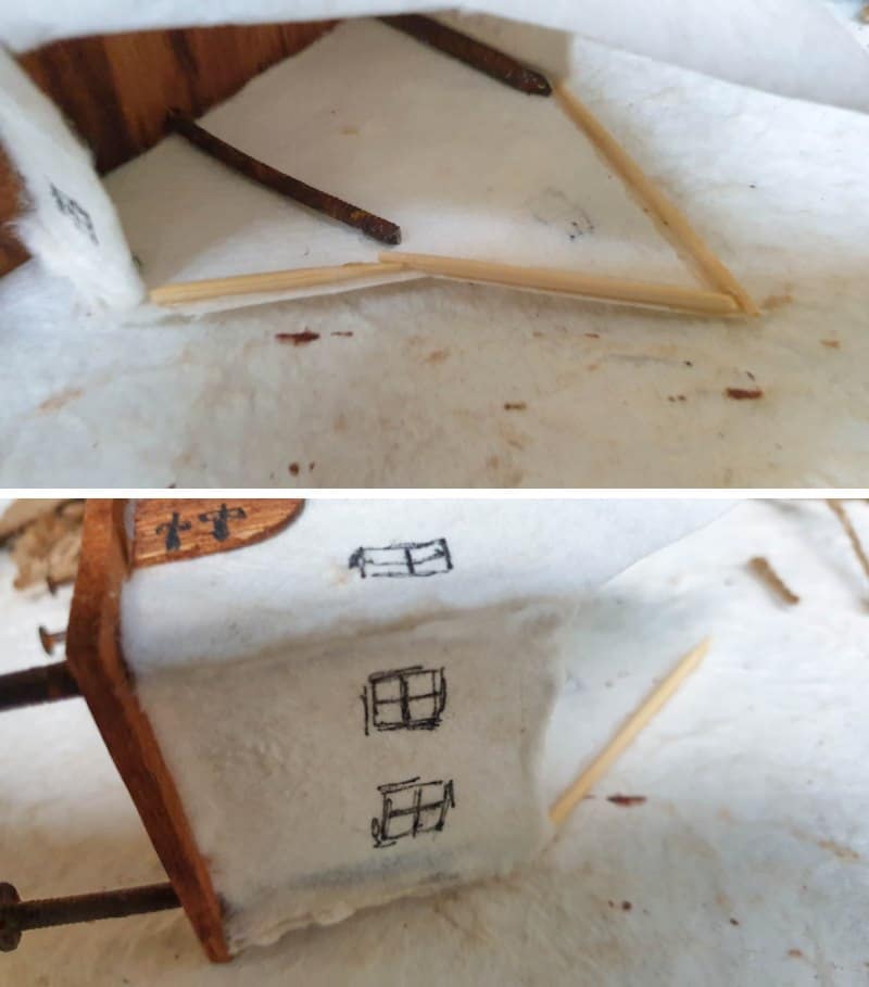 Glue toothpicks on the inside of the thatch roof for extra support