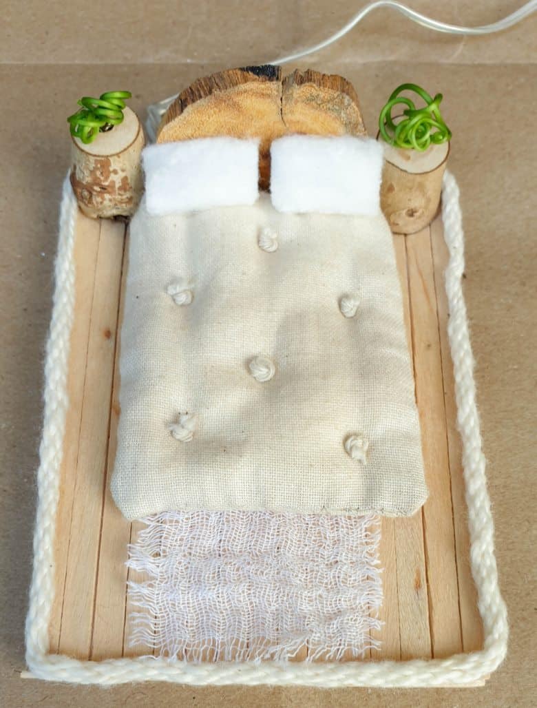 Build a platform and add a mattress, pillows and the bedside tables.
