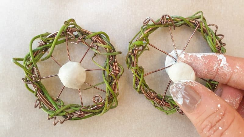 Squish the clay balls onto the wheels