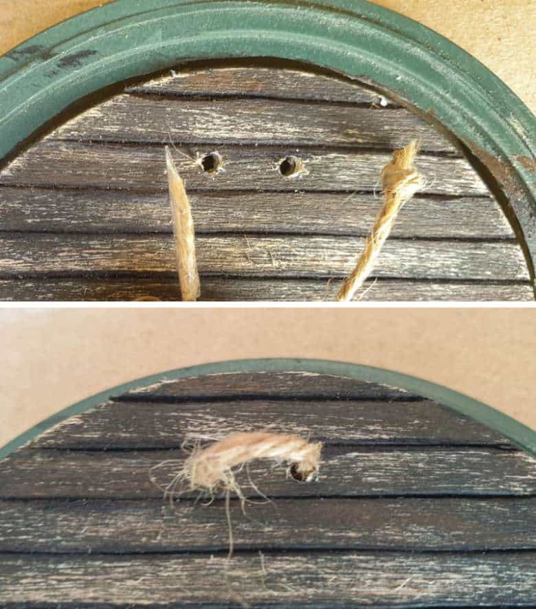 Thread a small piece of twine through the holes to make a door handle