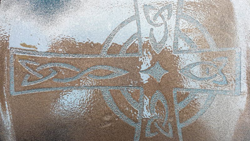 Once the sticky vinyl is stuck down, spray with leftover spray paint