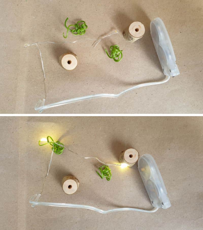 The bedside table lamps are small stumps with fairy lights