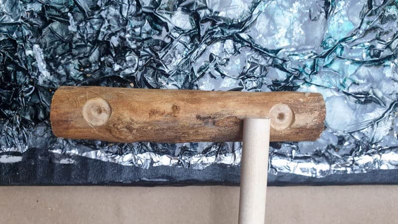 Getting ready to glue the branch handles onto the cardboard tray
