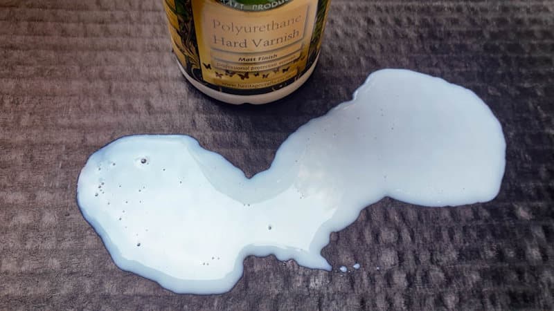 Apply 2 -3 coats of clear hard varnish to protect the bottom of the cardboard tray