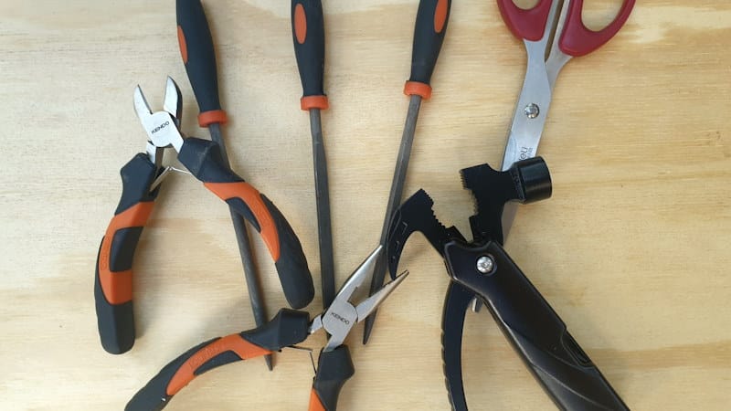 Layout your tools on a flat surface to get an idea of how big the caddy should be