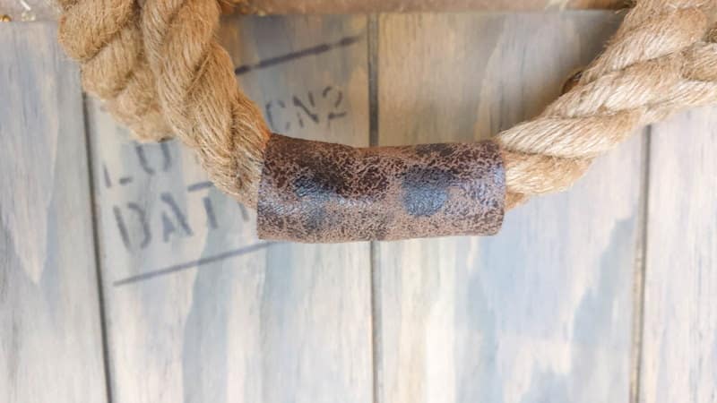 Wrap fabric or leather around the rope to disguise the join