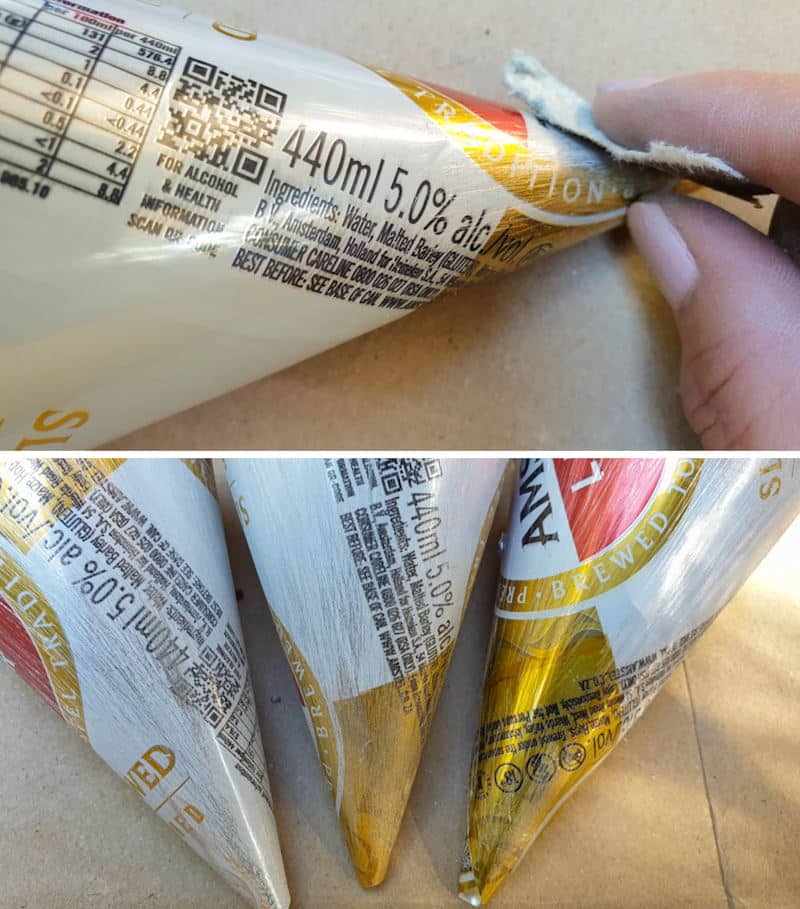 Using a 100-grit sandpaper sand the soda cans