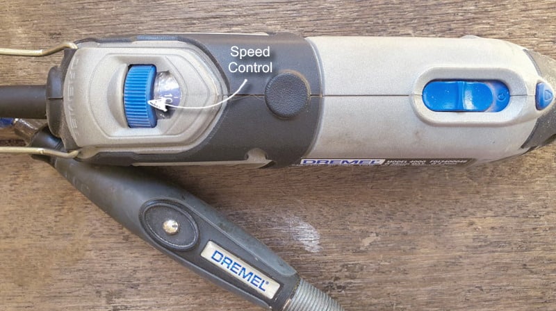 The speed control button on the Dremel