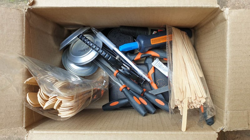 Miniature tools thrown in a box