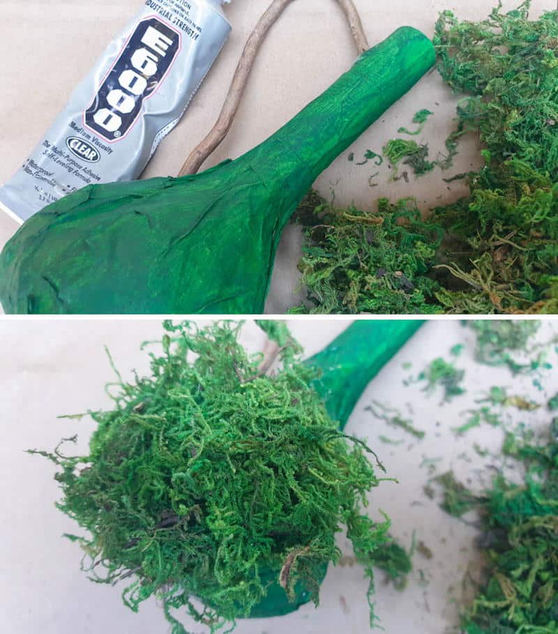 Apply glue to the vase base and add moss
