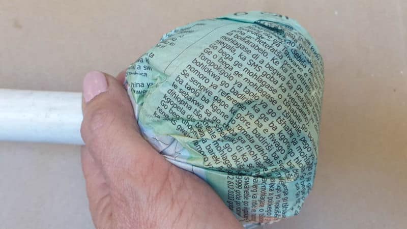 Create a ball of newspaper around the PVC pipe