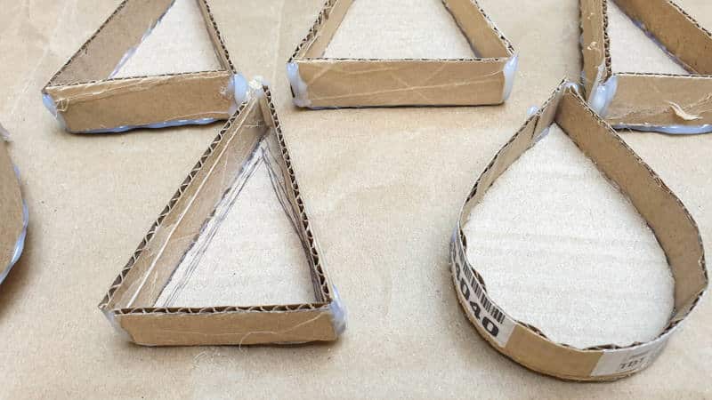 Reinforce the joins in the cardboard molds with glue or tape