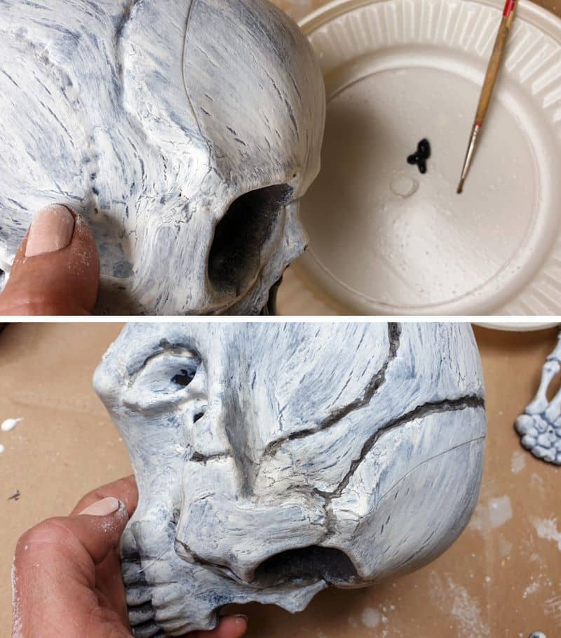 Use a little black paint to draw in the cracks in the cranium
