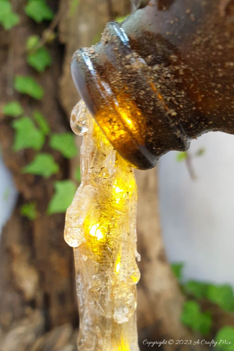 Unleash your inner sorcerer with this DIY Skull and Floating Bottle Planter tutorial! We&rsquo;ll show you how to get the bottle to defy gravity and create a dripping poison effect that casts an otherworldly glow over the scene at night. The tutorial includes a free poison label printable and loads of pictures to guide you through the process. No special tools needed. #ACraftyMix