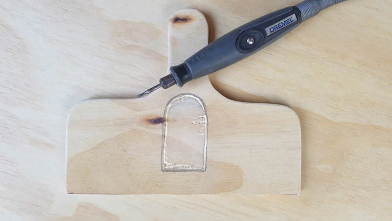 Carve a space into the wooden handle to house the battery pack