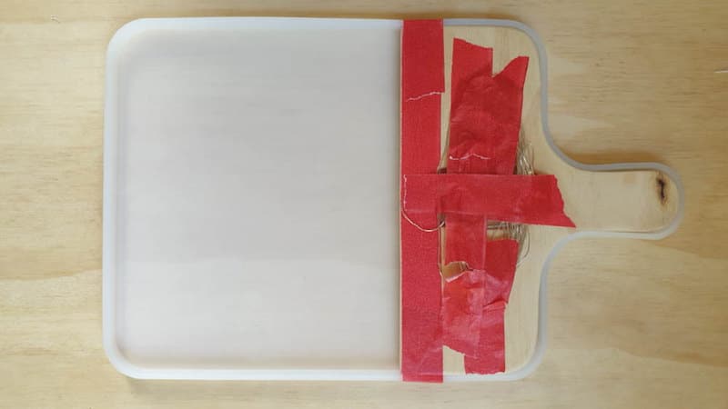 Tape the lights safely out the way while you pour the resin