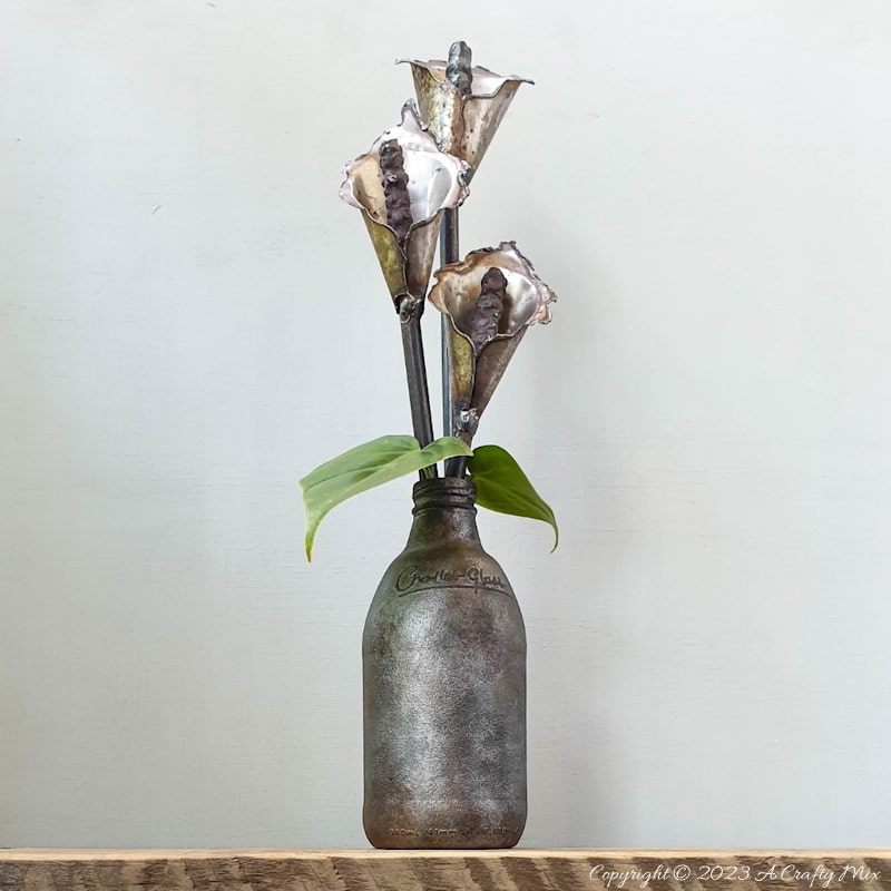 Ready to turn trash into treasure? Grab some inexpensive craft paint and join us as we show you how to give a glass bottle a metallic makeover. It&rsquo;s a quick and easy way to transform any glass containers into stylish decor pieces. The project can be completed in a morning and is suitable for a beginner who loves experimenting. Get the full tutorial with step-by-step instructions at #ACraftyMix
