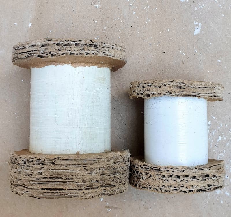 A view of the upcycled candleholders before applying texture paste