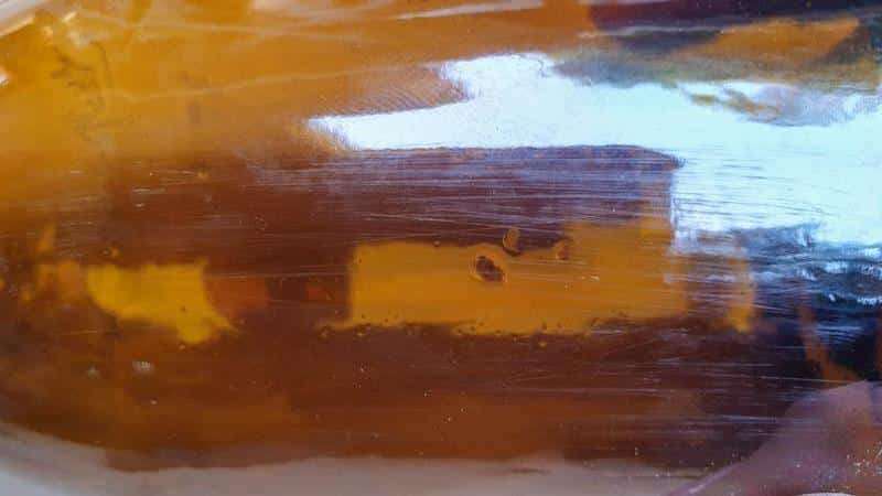 Sand the bottle to give the Mod Podge something to grip onto