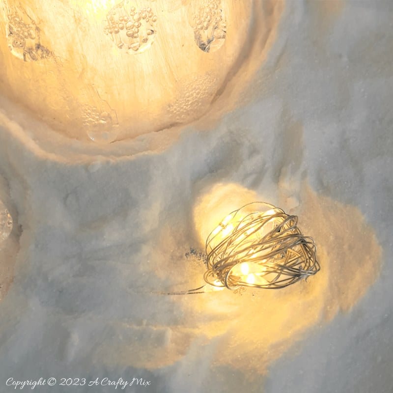 These upcycled shimmering light-filled Christmas trees are inexpensive and easy-to-make. The perfect holiday decorations to dress up your windowsill, tabletop, or mantel. They make lovely gifts too. No-one will ever believe they were thrown together in less than 30 minutes using plastic waste. Get the full tutorial at A Crafty Mix