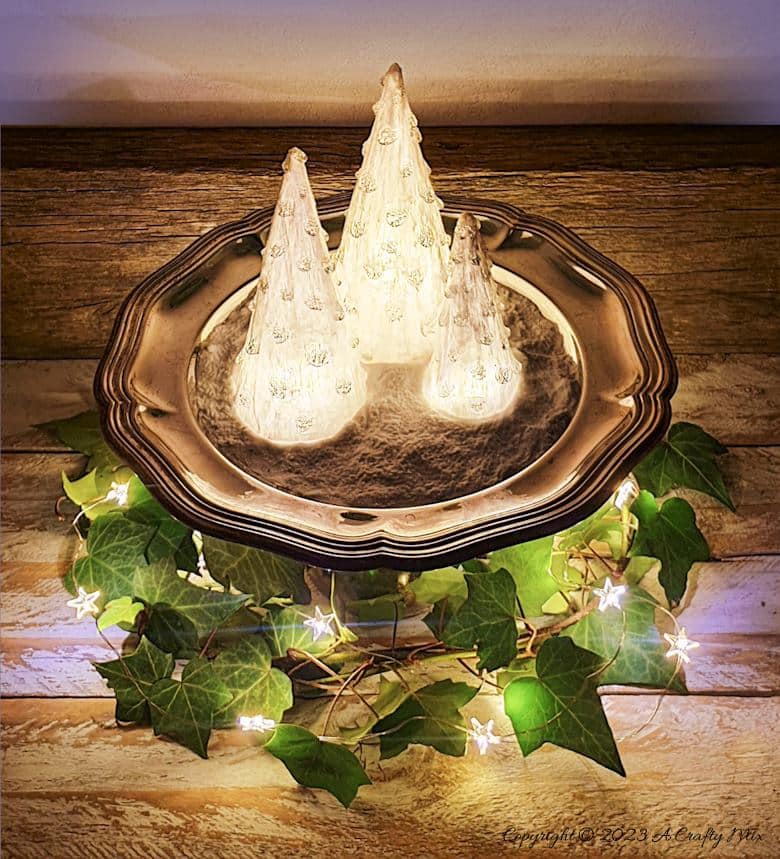 These upcycled shimmering light-filled Christmas trees are inexpensive and easy-to-make. The perfect holiday decorations to dress up your windowsill, tabletop, or mantel. They make lovely gifts too. No-one will ever believe they were thrown together in less than 30 minutes using plastic waste. Get the full tutorial at A Crafty Mix