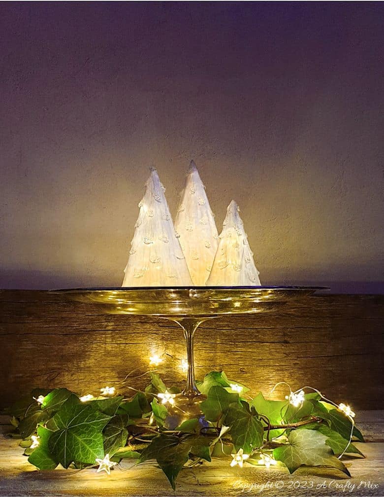 These gorgeous upcycled light-filled Christmas trees are inexpensive and easy-to-make. The perfect holiday decorations to dress up your windowsill, tabletop, or mantel. They make lovely gifts too. No-one will ever believe they were thrown together in less than 30 minutes using plastic waste. Get the full tutorial at A Crafty Mix