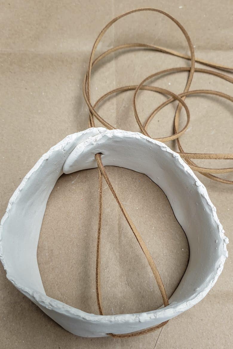 A view of the clay tubes after threading the cord through the holes