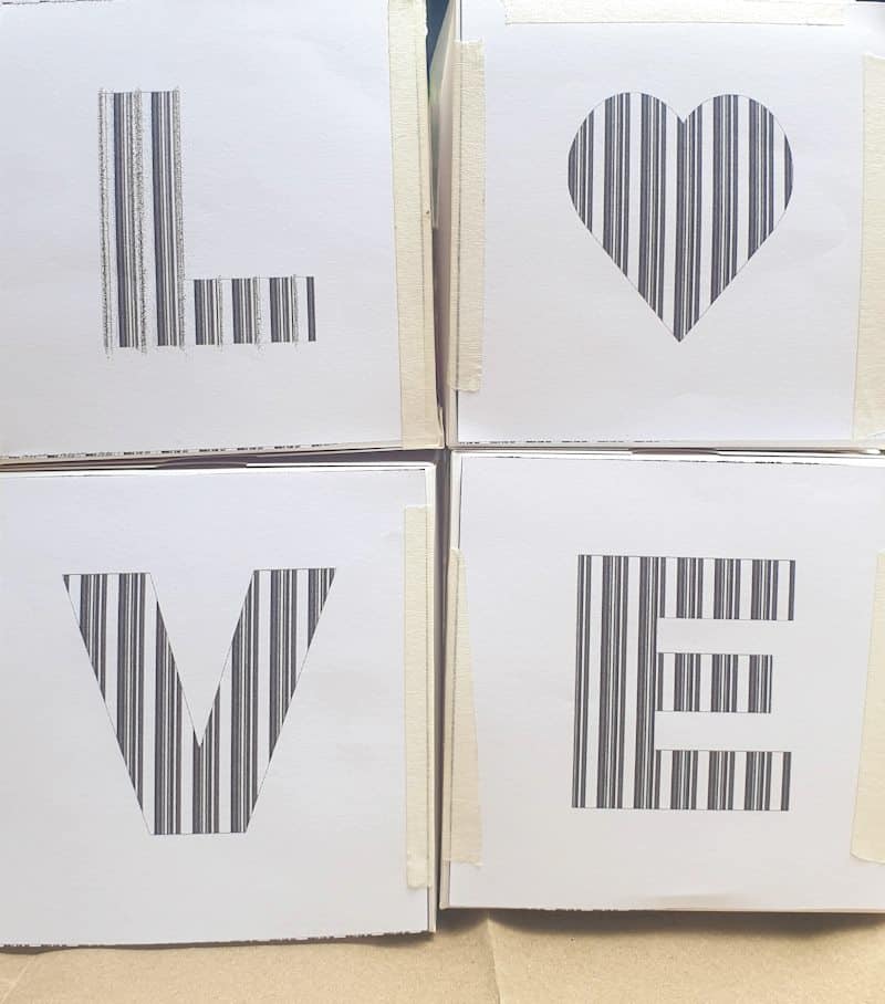 Tape the letter templates to the front of the box