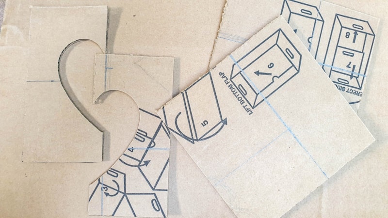 The cut cardboard pieces for the heart frame