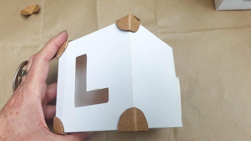 Glue the cardboard corners onto the box