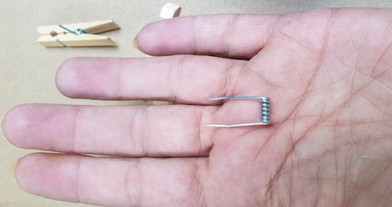 Remove the metal spring from the clothespin