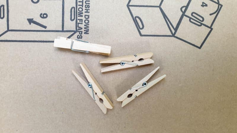 What you need to make a cardboard heart frame with clothespin hinges