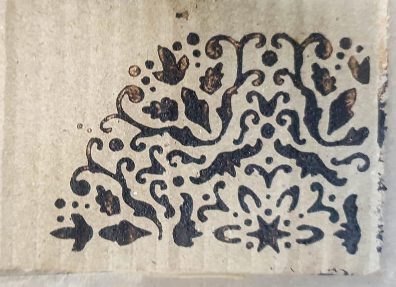 An example of the wood burning paste used on cardboard