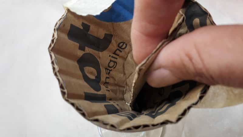 Gently remove the cardboard cone