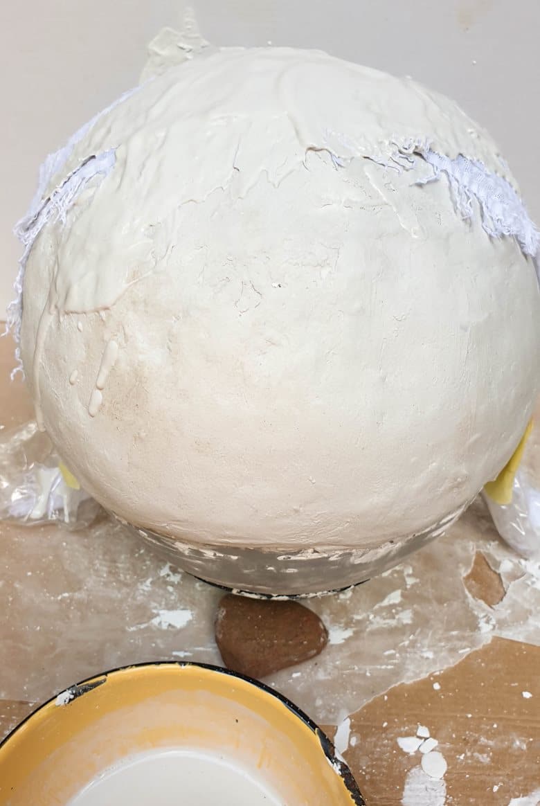 Add a layer of casting stone over the fabric strips